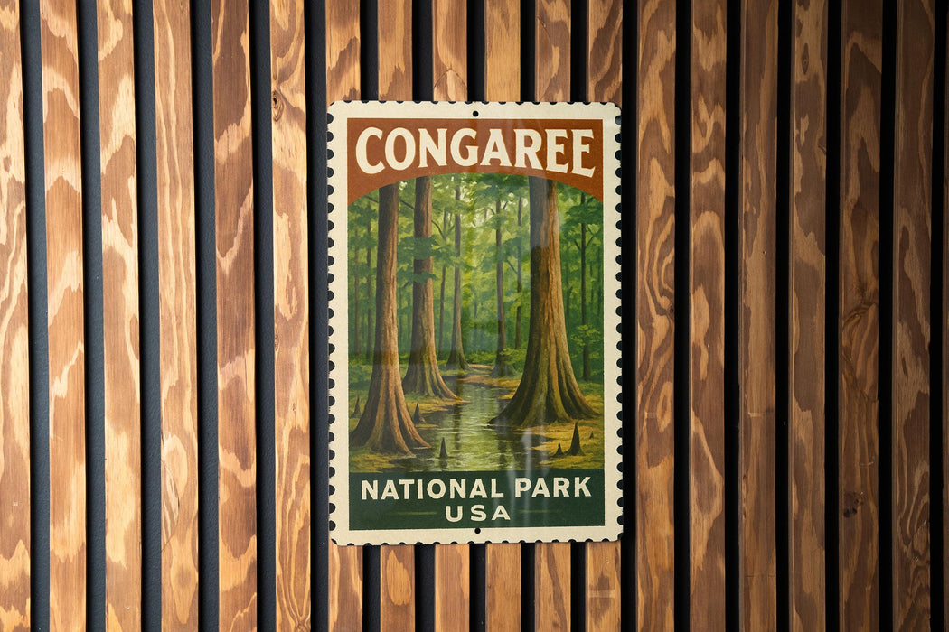 A postage stamp featuring a forest scene with tall trees and a stream, mounted on a wooden wall.