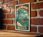 A vintage-style poster of the island of Holbox, Mexico, featuring a flamingo, palm trees, and a beach scene.