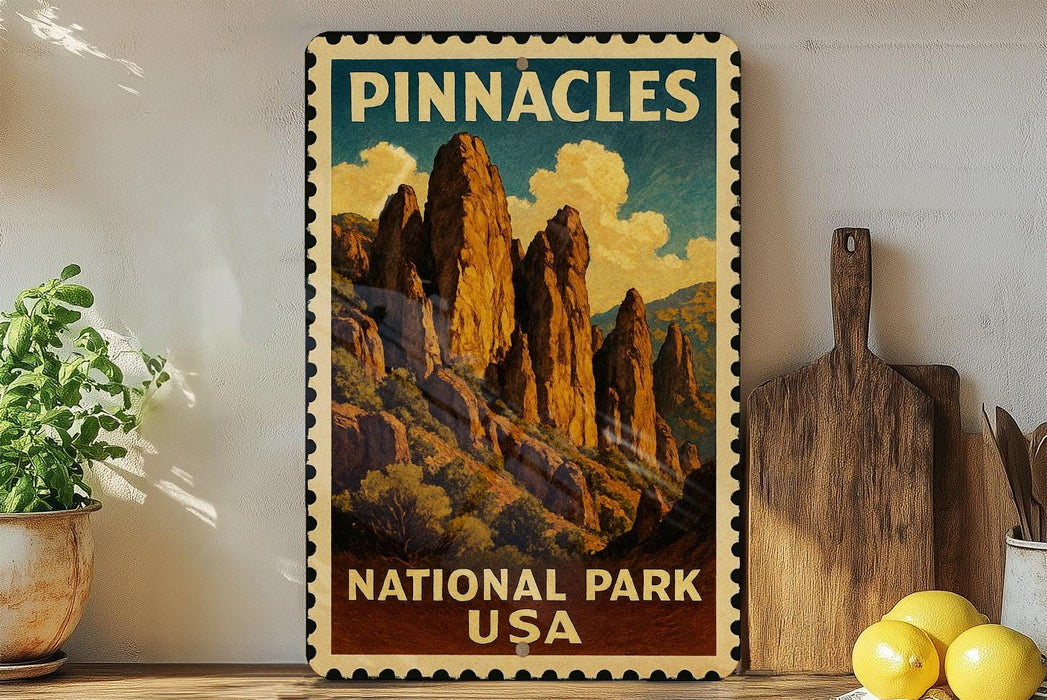 A vintage-style poster of Pinnacles National Park in the United States, featuring a mountainous landscape with tall rock formations and a cloudy sky.