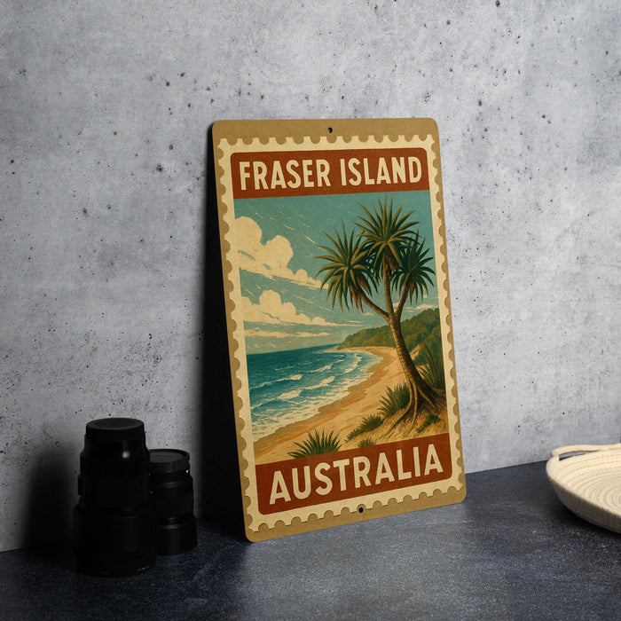 A vintage-style sign for Fraser Island, Australia, featuring a palm tree and beach scene.