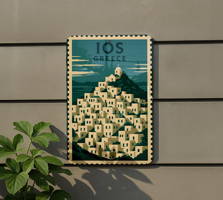 A vintage-style poster of a Greek island with a mountain and buildings, mounted on a wall.