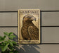 a large golden eagle with a textured background, mounted on a wall.