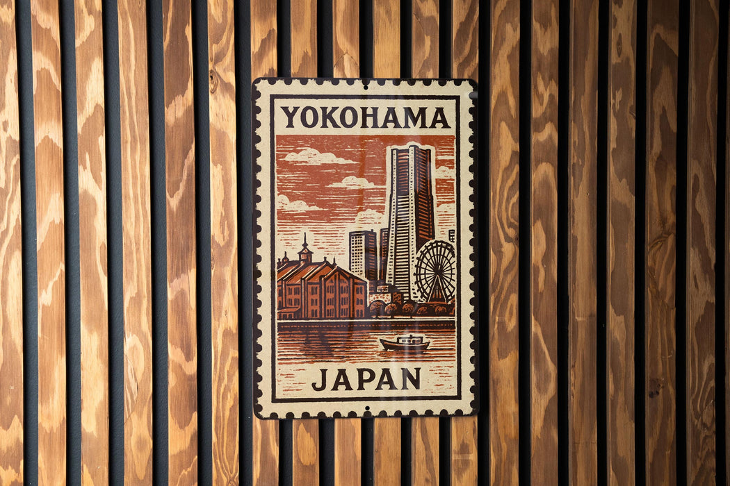 A postage stamp featuring a cityscape of Yokohama, Japan, with a ferris wheel and other buildings in the background.