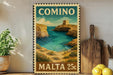 a vintage-style metal sign with a coastal scene, including cliffs, water, and a castle, mounted on a wall.