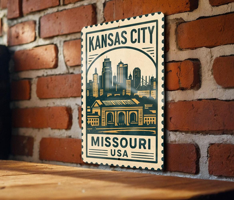 A metal sign with the text "KANSAS CITY MISSOURI USA" and an illustration of a city skyline, mounted on a brick wall.