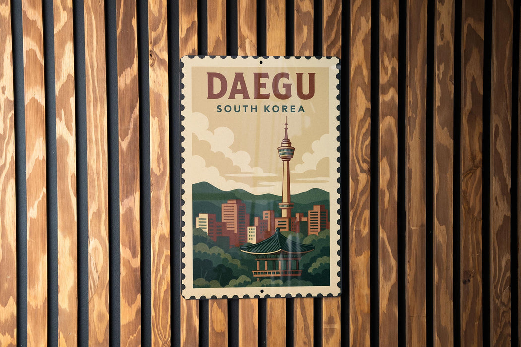 A vintage-style postage stamp depicting the Daegu, South Korea, skyline, with a traditional Korean temple in the foreground.