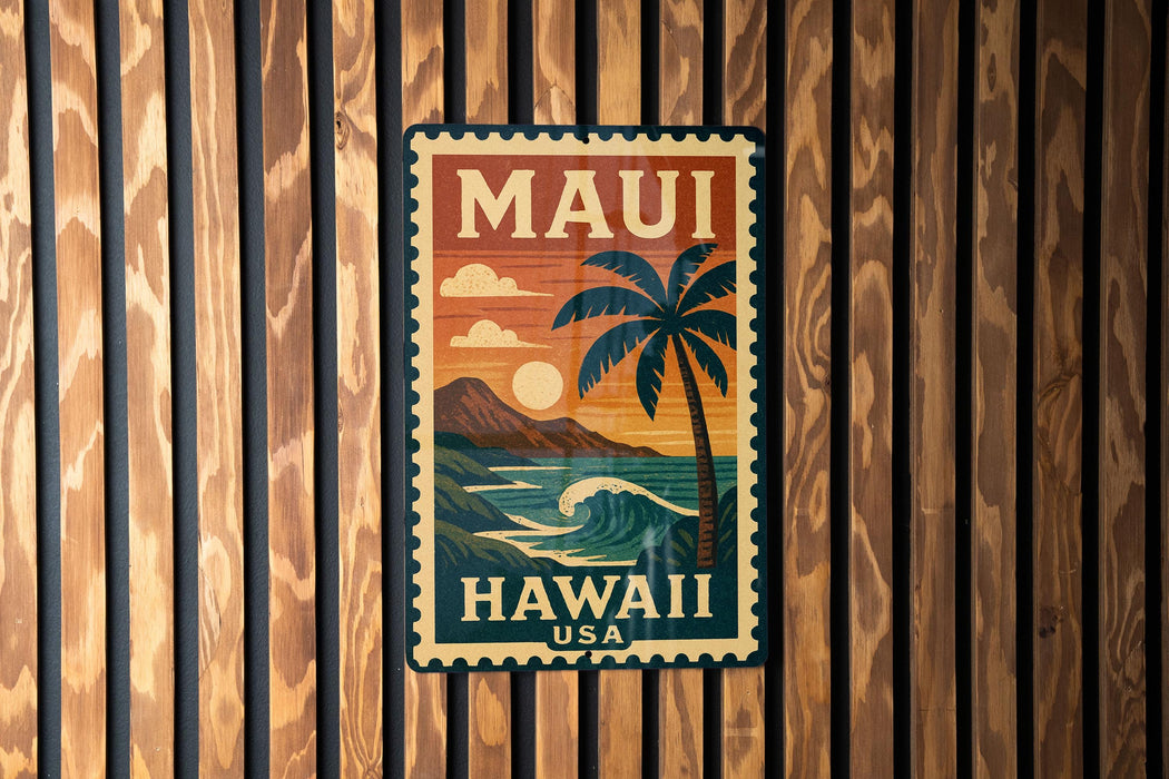 A vintage-style metal sign with the text "MAUI HAWAII USA" and a palm tree illustration, mounted on a wooden wall.