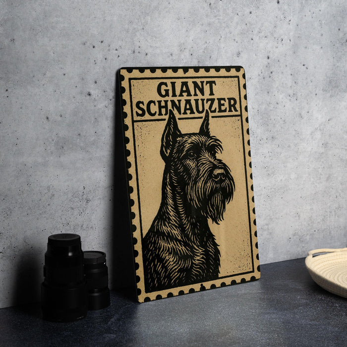 A framed poster of a giant schnauzer dog is displayed on a table, with a stack of black camera lenses and a white dish visible to the side.
