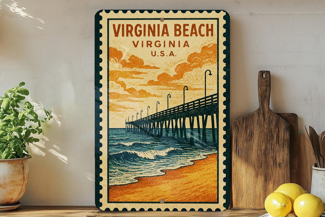 A vintage-style metal sign depicting a wooden pier extending into the ocean, with a cloudy sky in the background. The sign is framed with a border and hangs on a wall next to a wooden cutting board and a potted plant.