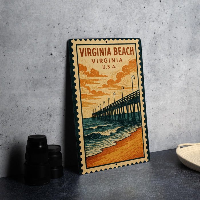 A vintage-style metal sign depicting a pier and beach scene, with the text "VIRGINIA BEACH VIRGINIA U.S.A."