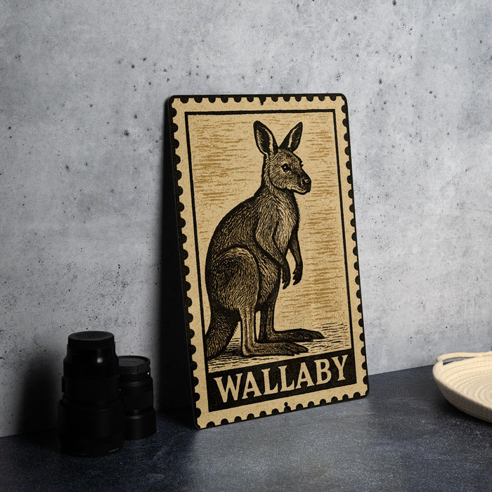 A metal sign featuring a kangaroo illustration, with the word "Wallaby" written below it, is displayed on a table.