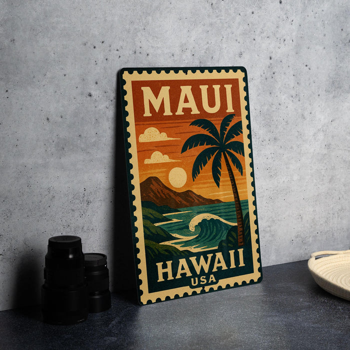 A vintage-style metal stamp depicting a tropical beach scene with a palm tree, ocean waves, and mountains, along with the text "MAUI HAWAII USA".