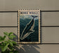 a framed illustration of a Minke whale, which is a type of whale, mounted on a wall.