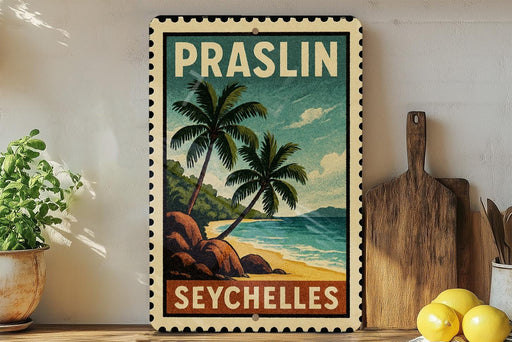 A vintage-style poster of Praslin, Seychelles, featuring palm trees and a beach scene, is displayed on a wall next to a wooden cutting board and a potted plant.