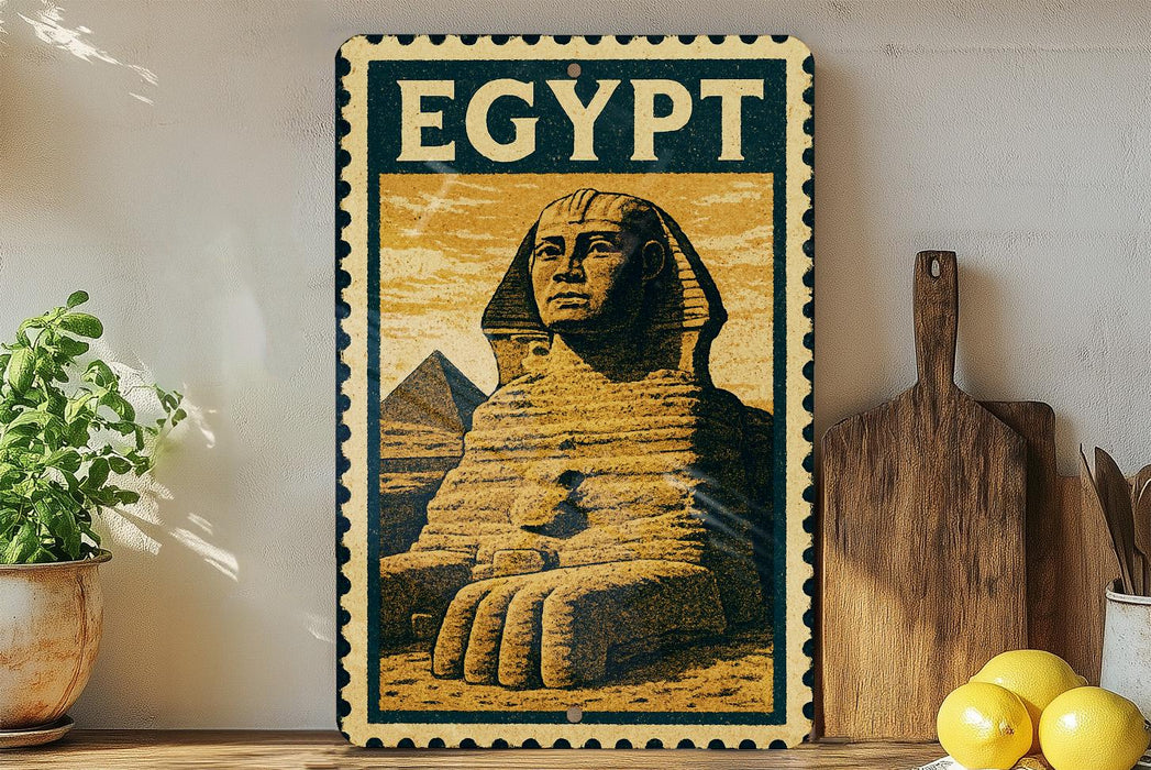 a framed illustration of the Sphinx, a famous ancient Egyptian monument, displayed on a shelf.