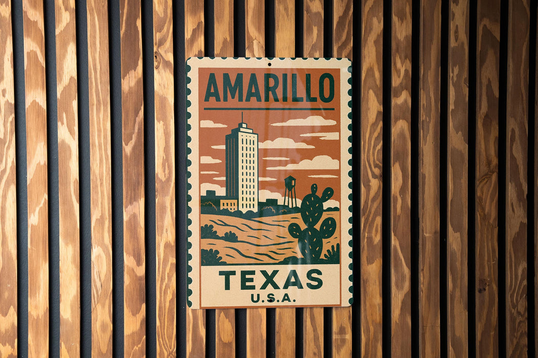 A vintage-style metal sign with the text "AMARILLO TEXAS U.S.A." displayed on it, mounted on a wooden wall.
