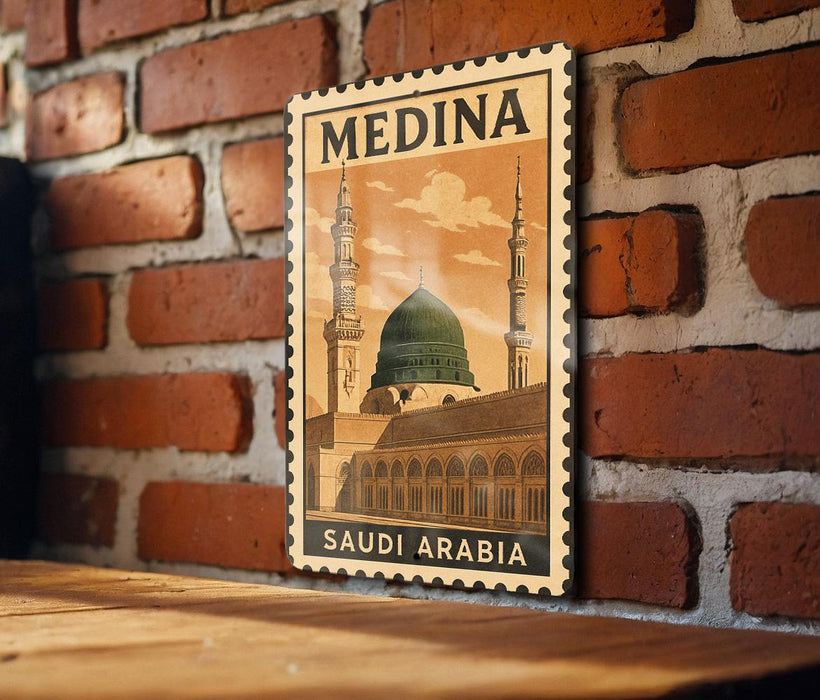 A framed poster of the mosque of Muhammad Ali, known as the Mosque of the Prophet, located in Saudi Arabia, is displayed on a brick wall.