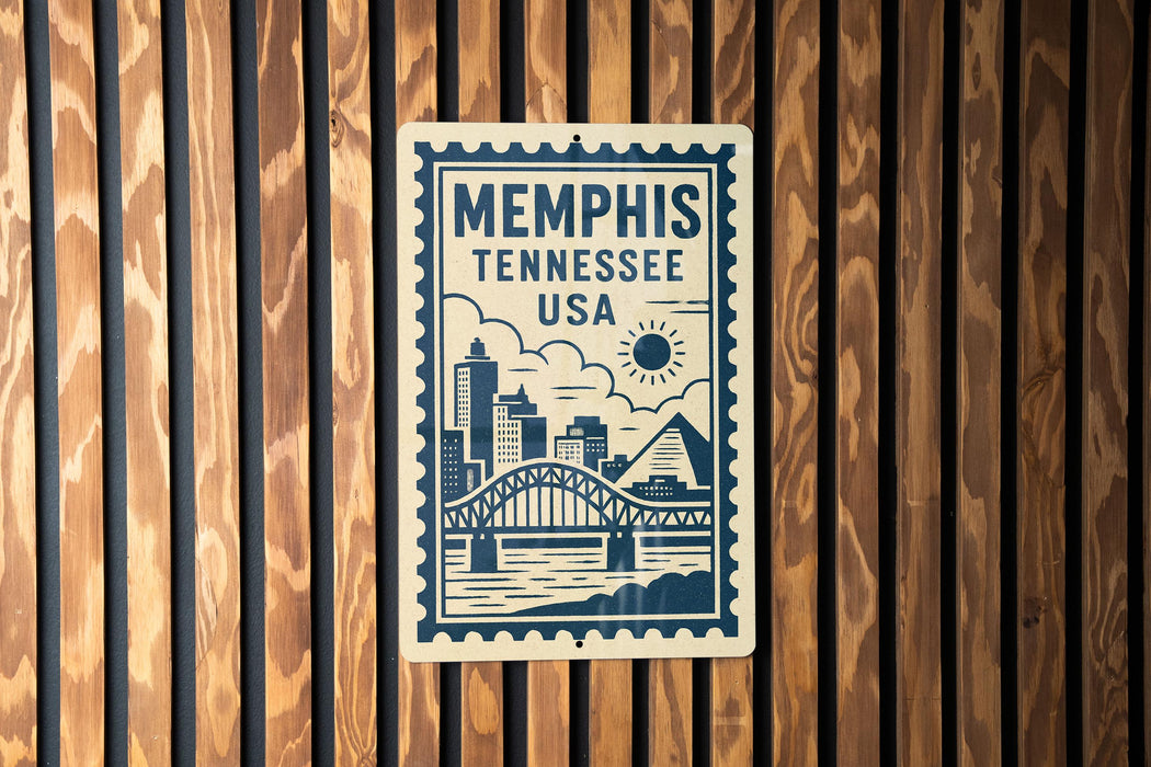 A metal sign with the text "Memphis, Tennessee, USA" and an illustration of a bridge and city skyline.