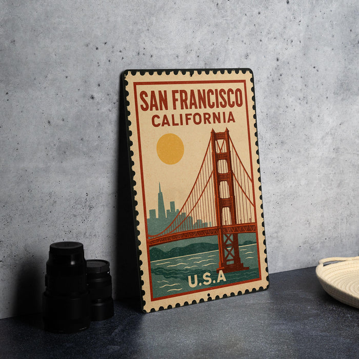 A vintage-style metal stamp depicting the Golden Gate Bridge in San Francisco, California, with the text "SAN FRANCISCO CALIFORNIA" and "U.S.A."
