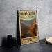 A vintage-style metal sign depicting the Grand Canyon, with the text "GRAND CANYON NATIONAL PARK USA" printed on it.