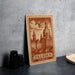 A wooden postcard featuring an illustration of Dresden, Germany, with the text "Dresden Germany" printed on it.