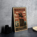 A vintage-style metal sign with the text "BISHKÉK" and an illustration of a statue of a man on a horse, placed on a gray surface next to some black camera lenses.
