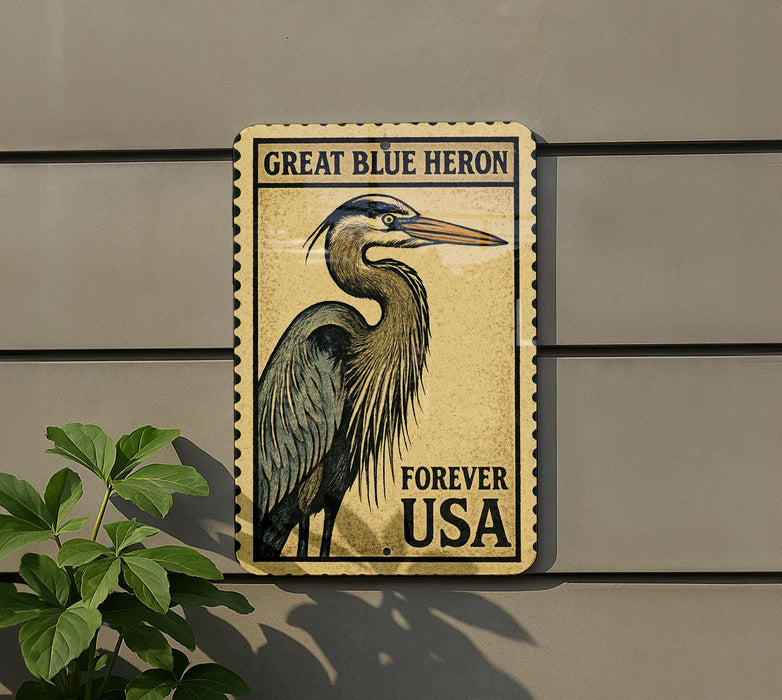 A postage stamp-like sign featuring a great blue heron, mounted on a wall next to a plant.