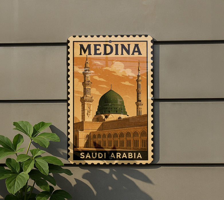 A metal sign with the word "MEDINA" and an illustration of a mosque, along with the text "SAUDI ARABIA".