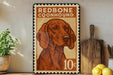 a vintage-style stamp with a redbone coonhound illustration, placed on a shelf next to a wooden cutting board and some lemons.