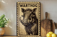 a wooden sign with a picture of a warthog, placed on a shelf next to a wooden cutting board and some lemons.