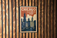 A vintage-style metal stamp depicting the Chicago skyline, with the text "CHICAGO ILLINOIS USA" prominently displayed.