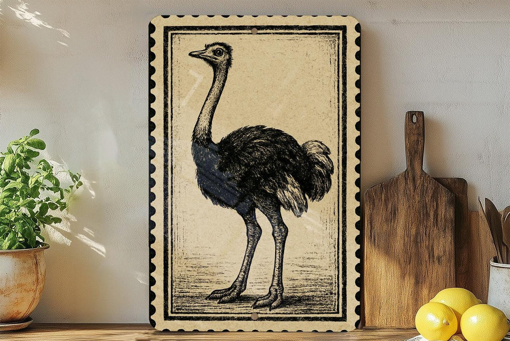 a framed illustration of an ostrich standing on a wooden surface, with a potted plant and a wooden cutting board visible in the background.