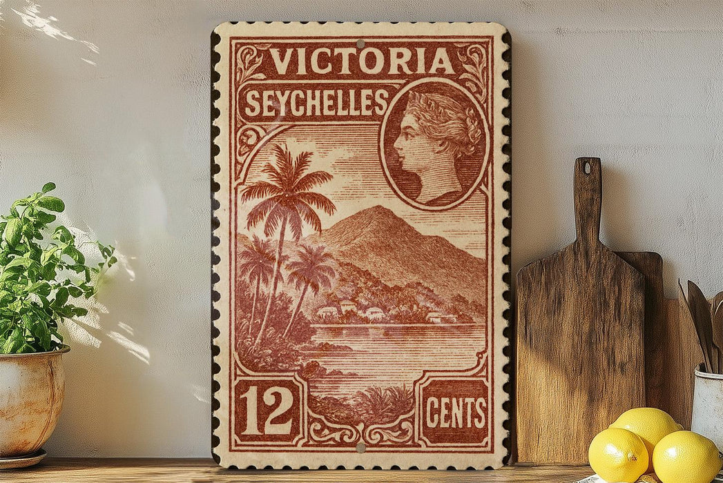 A vintage postage stamp from Victoria Seychelles, featuring a tropical island landscape and a portrait of Queen Victoria.
