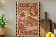 A vintage postage stamp from Victoria Seychelles, featuring a tropical island landscape and a portrait of Queen Victoria.