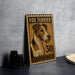 A metal sign featuring a fox terrier dog, with the number "30" printed on it, is displayed on a table next to some black camera lenses.