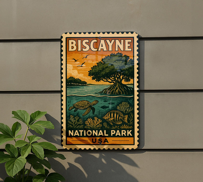 A vintage-style metal sign for Biscayne National Park, featuring an illustration of a tropical landscape with a palm tree, sea turtle, and fish.