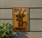 a sign with a kudu, a type of antelope, depicted on it.