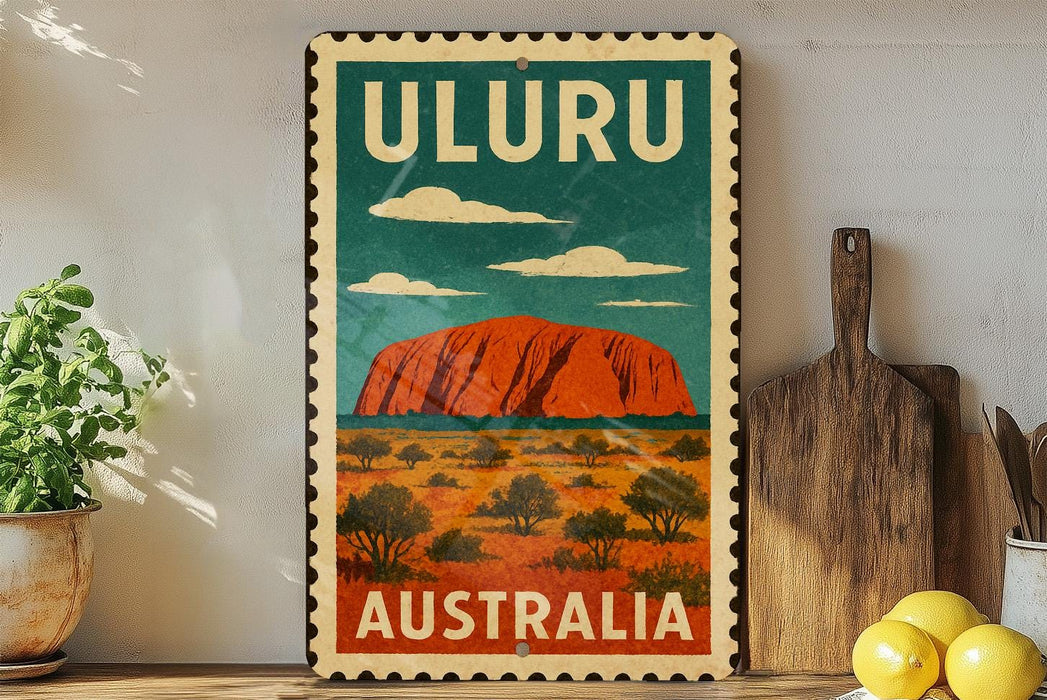 A vintage-style metal sign with the text "ULURU AUSTRALIA" and an illustration of Uluru, a famous rock formation in Australia.