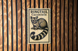 A sign for the Ringtail Cacomistle, featuring a raccoon-like animal illustration.