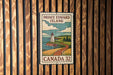 A vintage-style postage stamp from Prince Edward Island, Canada, featuring a lighthouse and a coastal landscape.