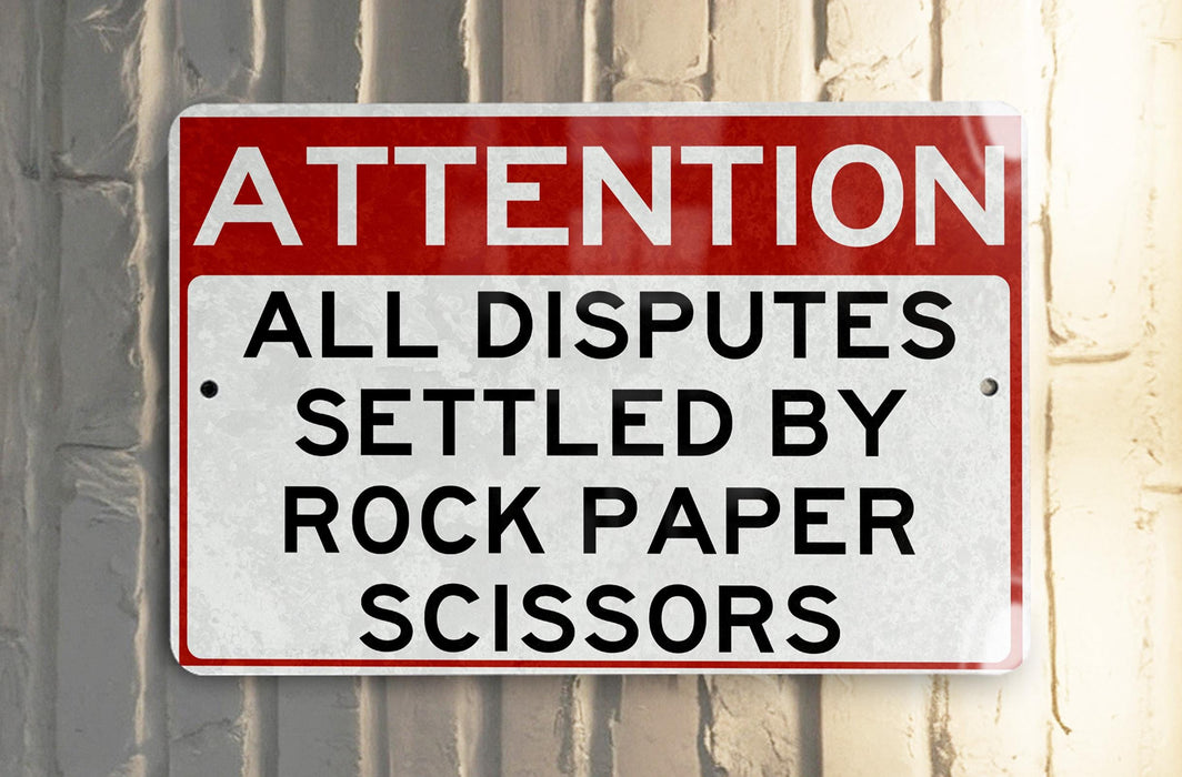 a red and white sign on a white wall