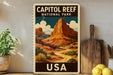 A vintage-style poster of Capitol Reef National Park in the United States, featuring a mountain landscape with a winding road and a cloudy sky.