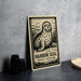 A metal sign featuring a seal illustration, with the text "HARBOR SEAL PHOCA VITULINA" printed on it.