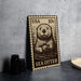 A metal stamp featuring a sea otter, with the text "USA 10c" printed on it.