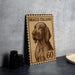 A wooden stamp with a dog illustration and the number 60 on it, placed on a gray surface next to some black camera lenses.