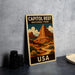 A vintage-style poster of Capitol Reef National Park in the USA, featuring a mountainous landscape with a winding road and desert vegetation.
