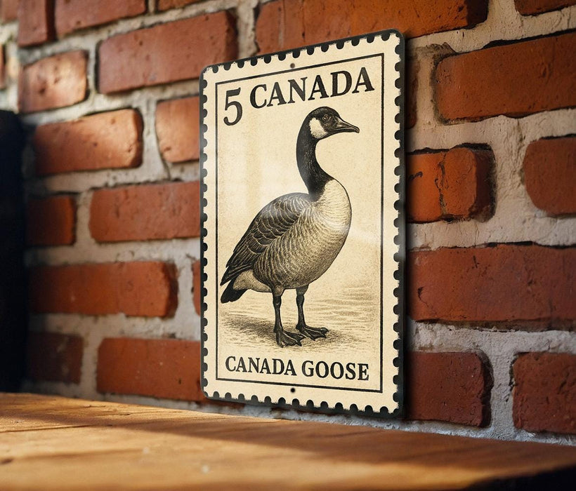A metal sign featuring a Canadian goose on a brick wall.