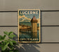 A vintage postage stamp depicting the Lucerne, Switzerland landmark, with a mountain backdrop and a tower in the foreground.