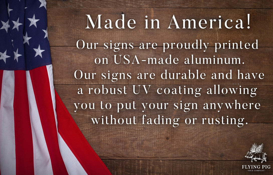 a wooden sign with an american flag on it