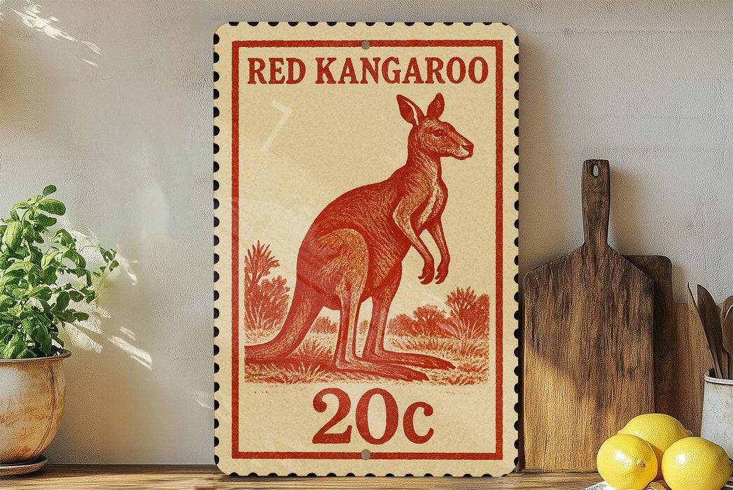 A red kangaroo stamp with the text "RED KANGAROO" and "20c" printed on it, placed on a wooden surface next to a potted plant and a wooden cutting board.